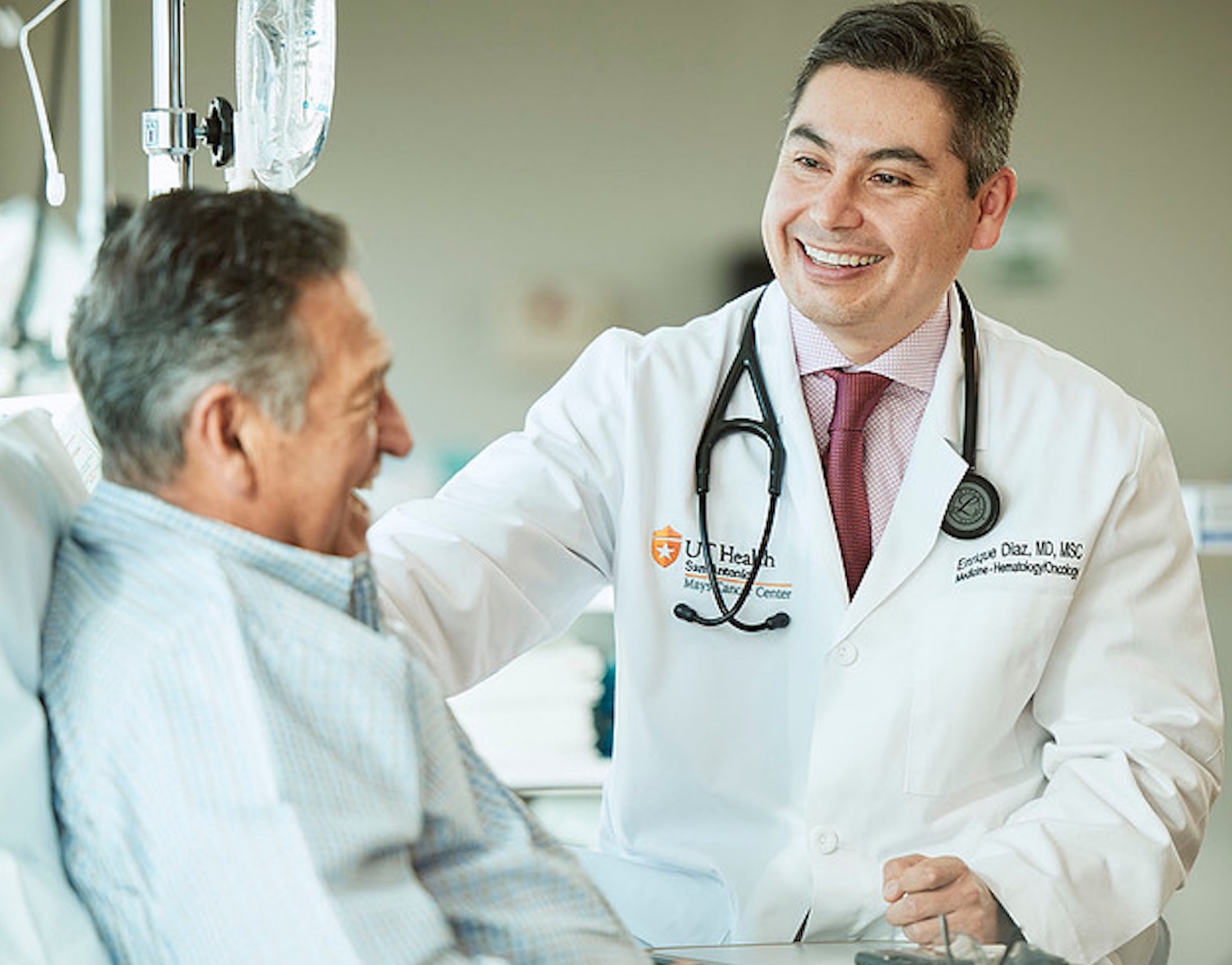 Enrique Diaz Mays Cancer Center smiling with patient